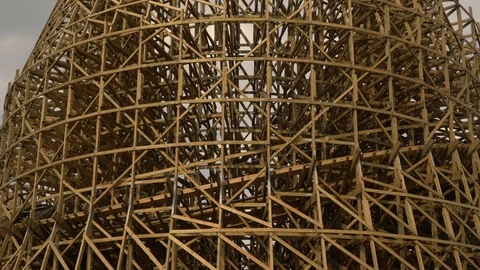 Wooden rollercoaster structure with a wagon drives through it in china Video stock 106011158