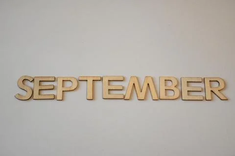 Wooden September lettering on a light background Stock-Fotos