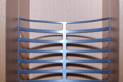 Wooden shelf with a plastic insert for compact discs Stock-Fotos
