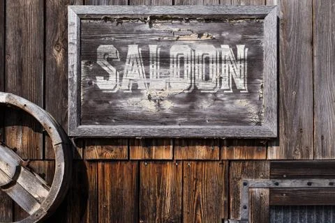 Wooden sign with word saloon Photos