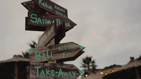 Wooden signpost with arrow pointer with information of direction outdoors Stock Footage 269895053