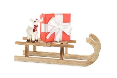 Wooden sleigh with present and decorative reindeer on white background Stock Photos