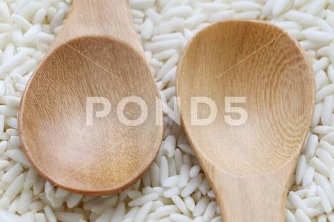 Wooden spoon of empty on organic white rice, glutinous rice or sticky rice. Stock Photos