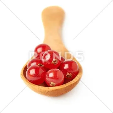 Wooden spoon filled with Red Currant isolated over white background Stock Photos
