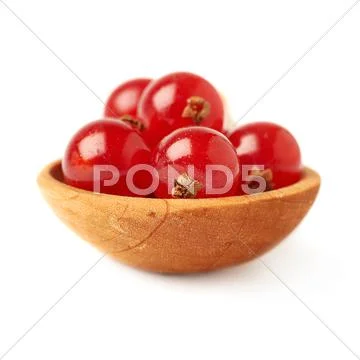 Wooden spoon filled with Red Currant isolated over white background Stock Photos