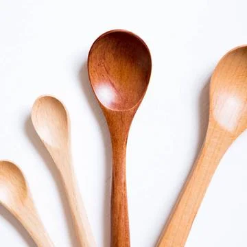Wooden spoons on white background Wooden spoons on white background Copyri... Stock Photos