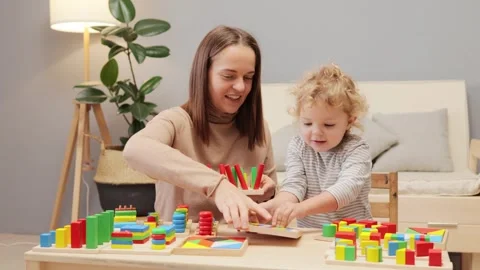 Wooden stacking shape. Baby development. Learning play. Cognitive exploration. Stock Footage 256289681