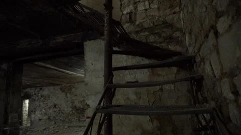 Wooden staircase for going up inside an old underground ancient building Video stock 329393045