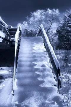 Wooden stairs covered in winter snow Stock Photos