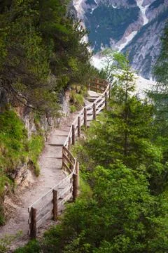 Wooden stairs in the mountains with mudflow on background Stock Photos