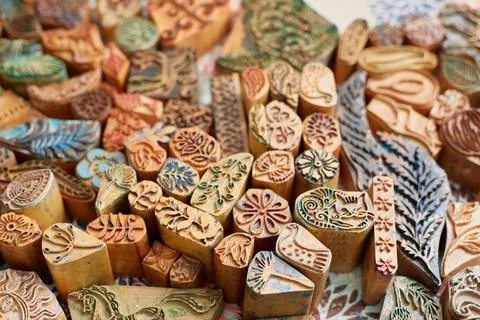 Wooden stamp for hand printing patterns on fabric with paint. Printed fabric Stock Photos