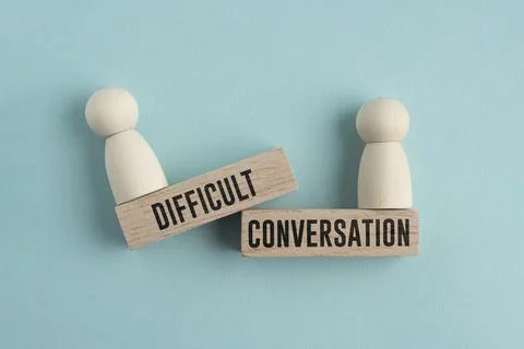 Wooden stick with the word DIFFICULT CONVERSATION. difficult concept of con.. Stock Photos