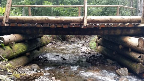 Wooden structure artificial waterfall under the man-made bridge Channel concept Stock Footage 116720039