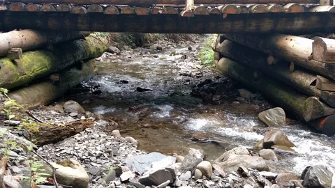 Wooden structure artificial waterfall under the man-made bridge Channel concept Stock Footage 116720104