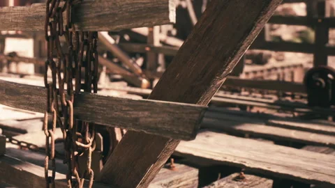 Wooden structure with chains and pulleys at a construction site Stock Footage 343543160
