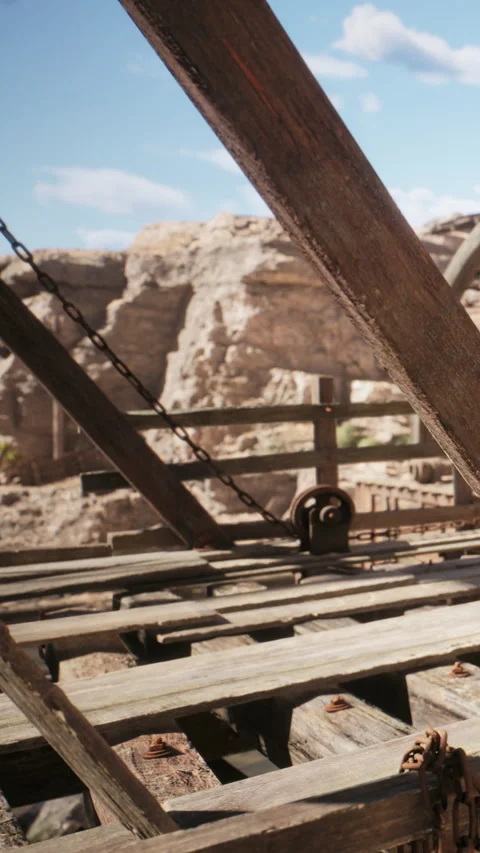 Wooden structure with chains on a construction site in a dry landscape Stock Footage 339766597