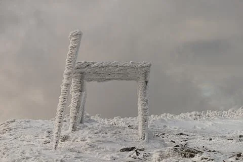 A wooden structure completely covered in thick rime ice and snow on Polonin.. Stock Photos