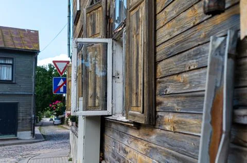 The wooden structure features an open window, revealing its rustic charm in a Stock Photos