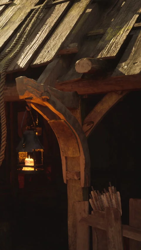 Wooden structure with lanterns hanging in a rustic setting during golden hour 스톡 동영상 342162388