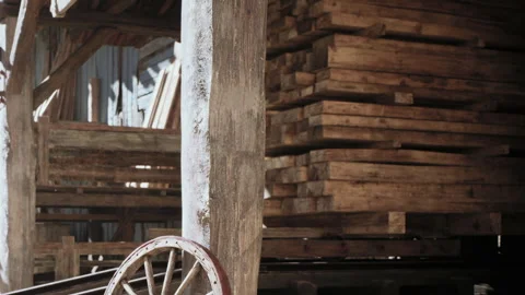 Wooden structure in a lumber yard with stacks of timber Stock Footage 344409546