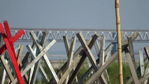 Wooden structures with bridge in background Stock Footage 331277478