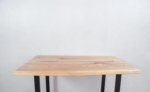 Wooden stylish table made of solid wood with epoxy resin on the background of Stock Photos