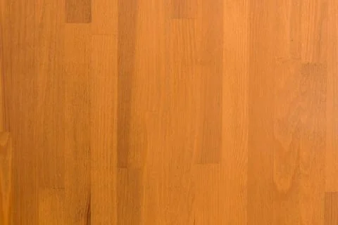 Wooden surface as background texture with rays of light. Stock Photos