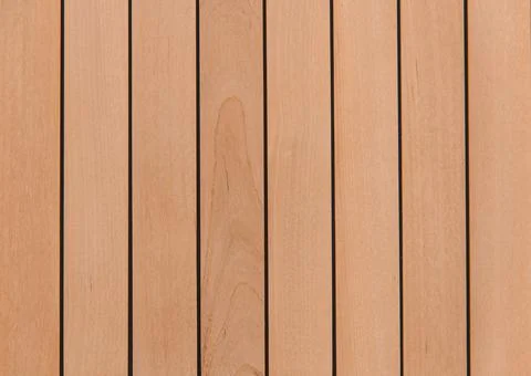 Wooden surface as background texture with rays of light. Stock Photos