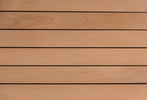 Wooden surface as background texture with rays of light. Stock Photos