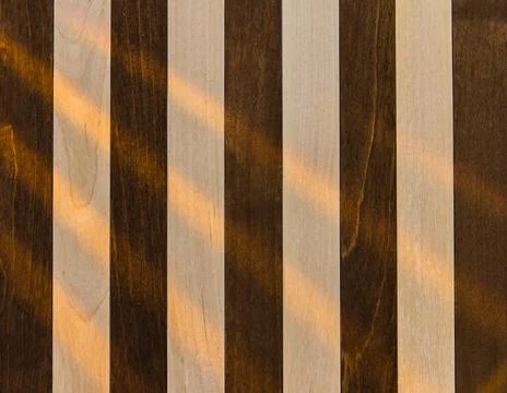 Wooden surface as background texture with rays of light Stock Photos