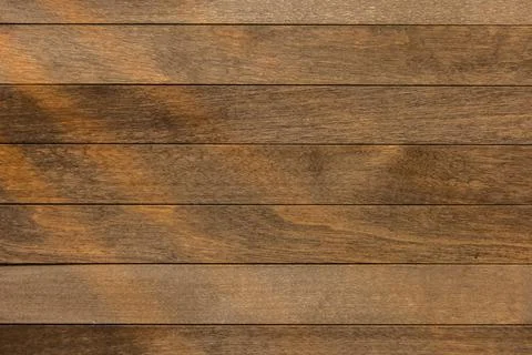 Wooden surface as background texture with rays of light Stock Photos
