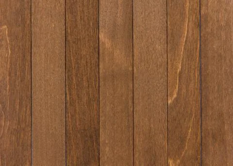 Wooden surface as background texture with rays of light. Stock Photos