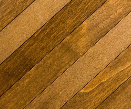 Wooden surface as background texture with rays of light. Stock Photos