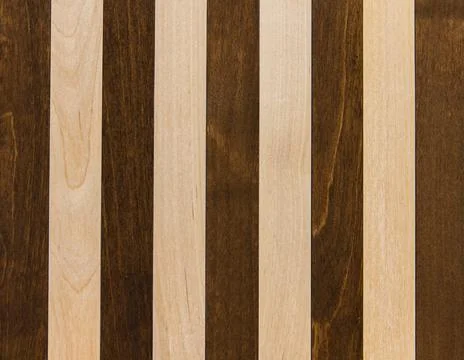 Wooden surface as background texture with rays of light. Stock Photos