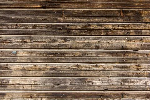 Wooden surface as background texture with rays of light. Stock Photos