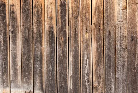 Wooden surface as background texture with rays of light. Stock Photos