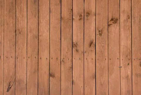 Wooden surface as background texture with rays of light. Stock Photos