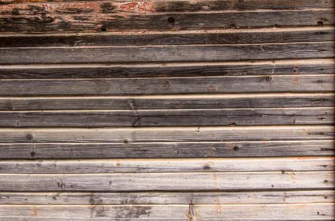 Wooden surface as background texture with rays of light. Stock Photos