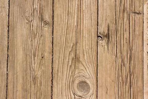 Wooden surface as background texture with rays of light. Stock Photos