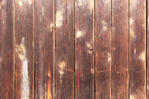 Wooden surface as background texture with rays of light. Stock Photos