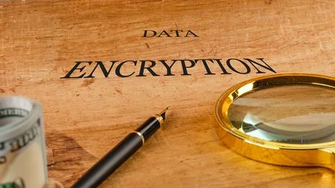 On a wooden surface, the words data encryption stand out prominently. A mag.. Stock Photos
