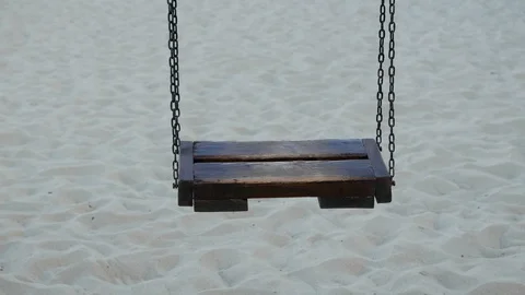 Wooden swing on empty beach. Stock Footage 128731130