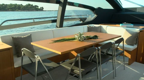 Wooden table and sofas on a luxury yacht Stock Footage 67500879