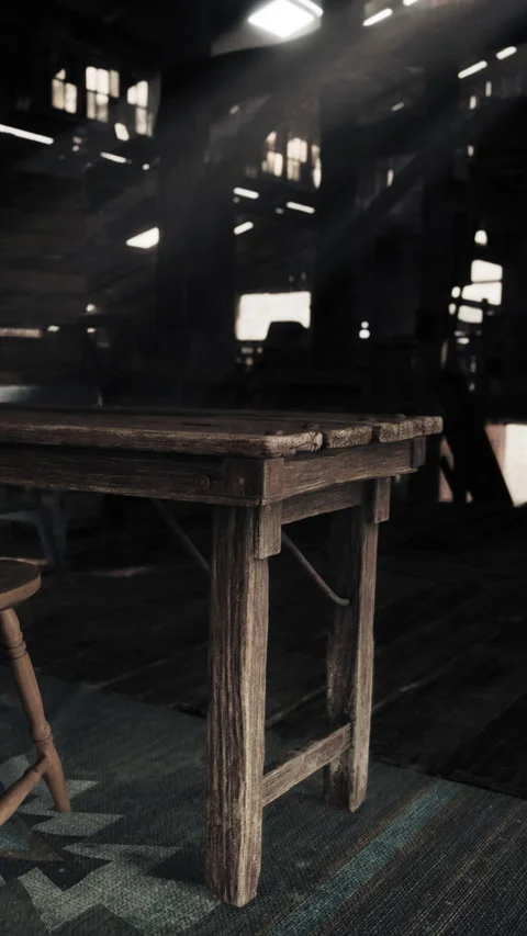 Wooden table with chair in empty building with sunlight streaming in Stock Footage 337972098