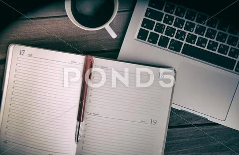 Wooden table with office supplies Stock Photos