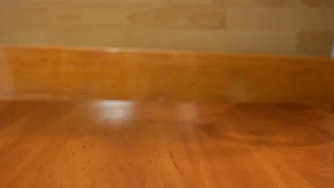 On a wooden table put a transparent kettle Stock Footage 85434325