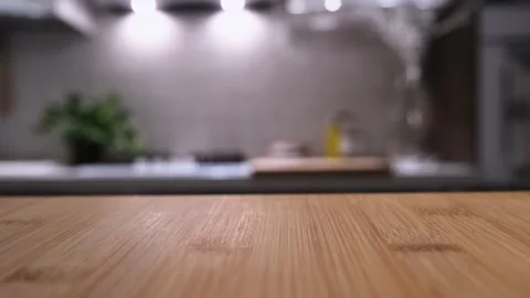 Wooden table top on blur kitchen room background. Video stock 162662954