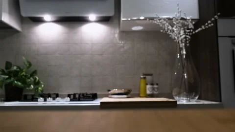 Wooden table top on blur kitchen room background. Video stock 162664899