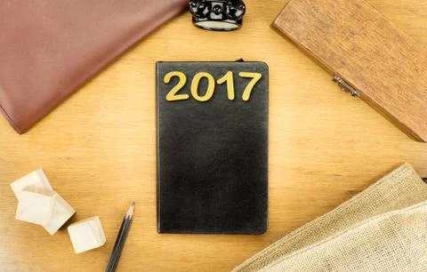 Wooden Table top with  clock,type box,notebook,leather bag and pencil, Templa Stock Photos