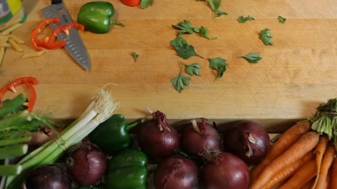Wooden table top with vegetables. Preparing food in the kitchen. Stock Footage 106078287